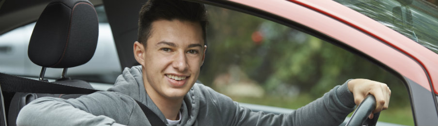 teenager driving a rental car